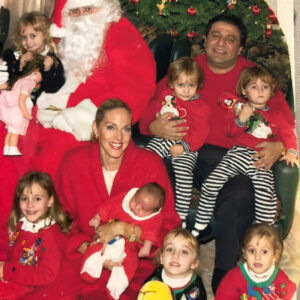 Christmas family photo with Santa in front of a Christmas Tree