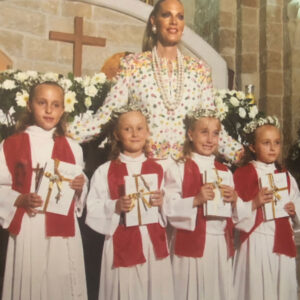 Debra Vallentyne with daughters in a church